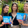 Louise with her daughters, who are holding campaign posters